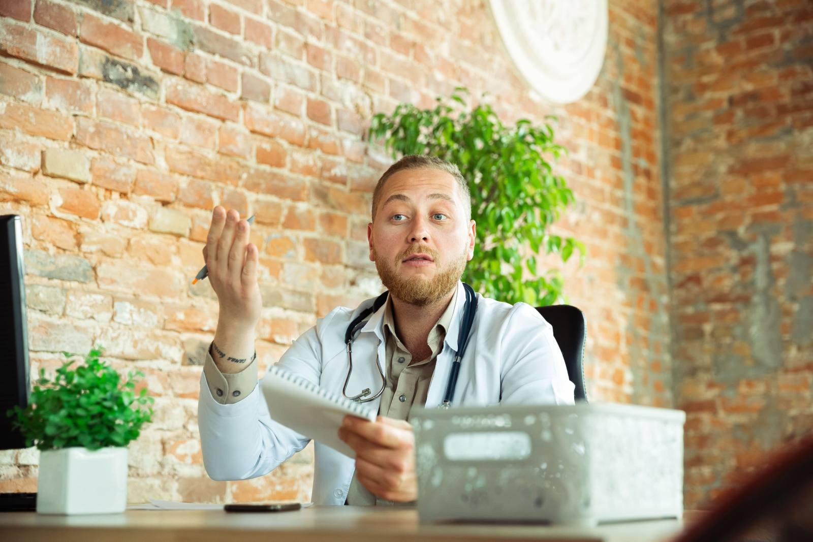 caucasian doctor consulting patient working cabinet